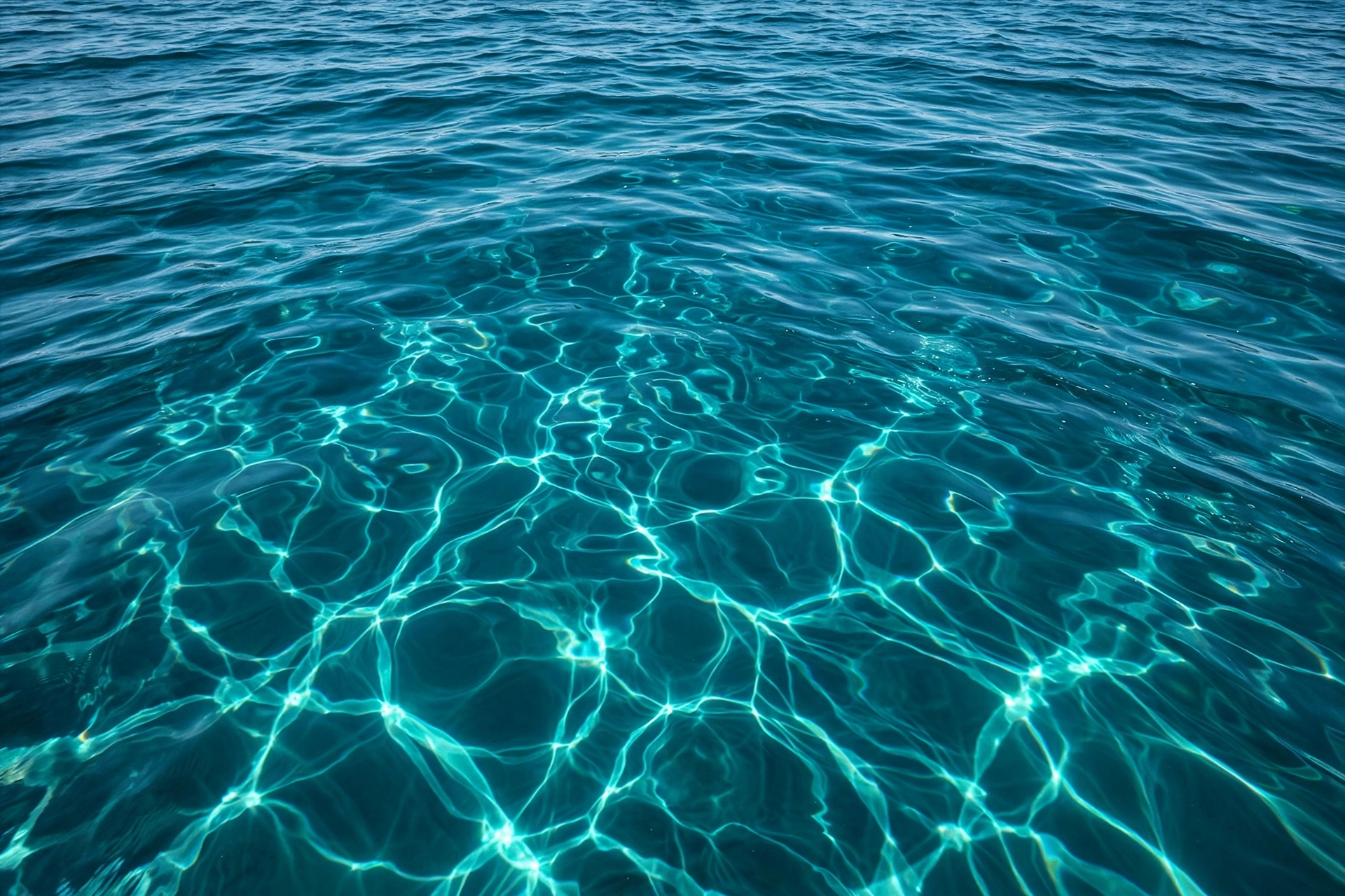 Clear teal water with light rippling across the surface